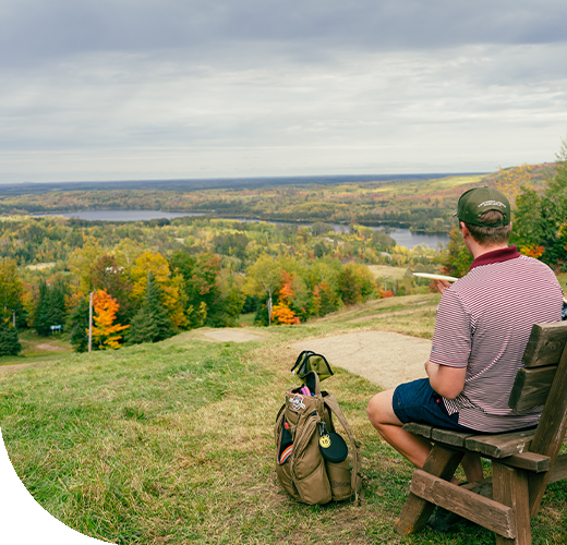 Disc Golfer overlooking a valley